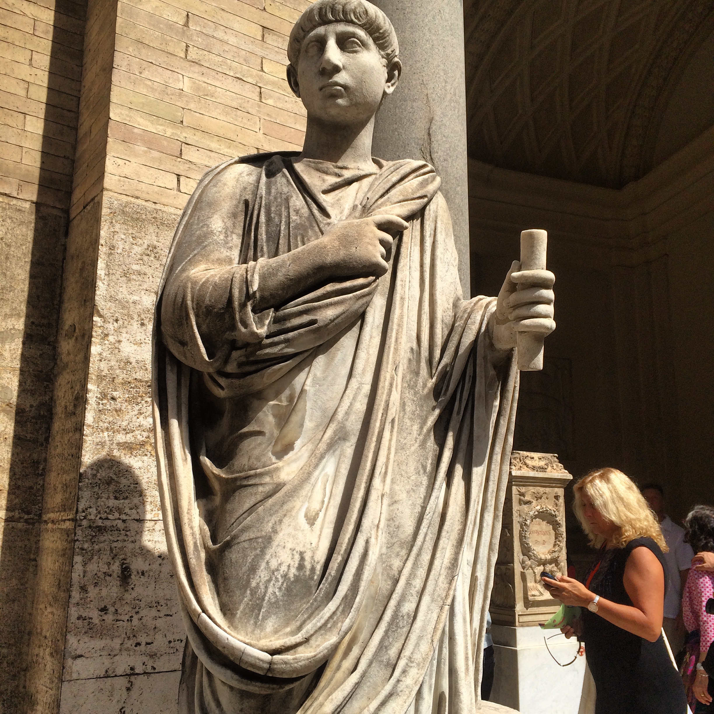 Statue of a Roman holding a scroll.
