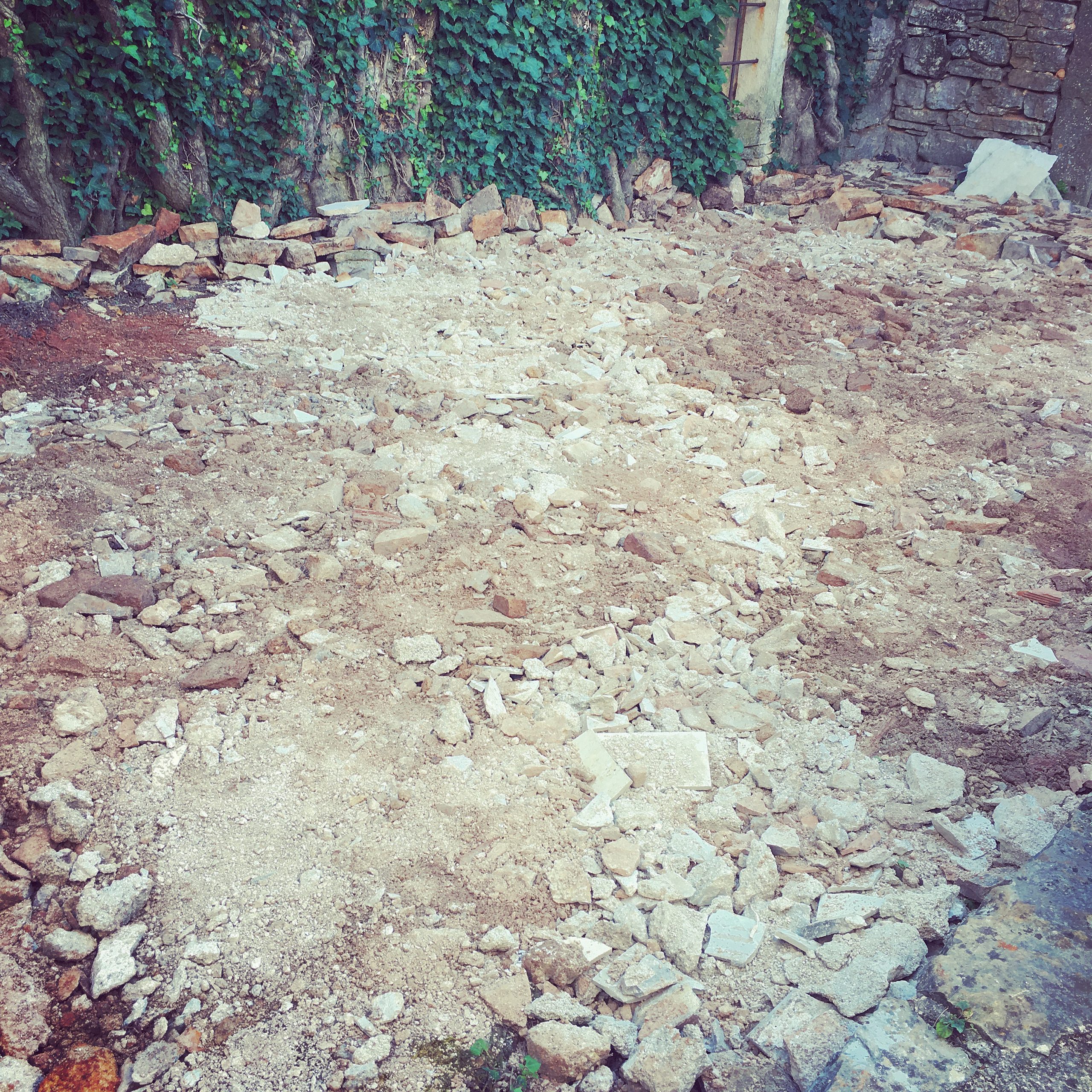 The DURING shot, as rubble was dug out, smashed up and refilled, to make a level surface...