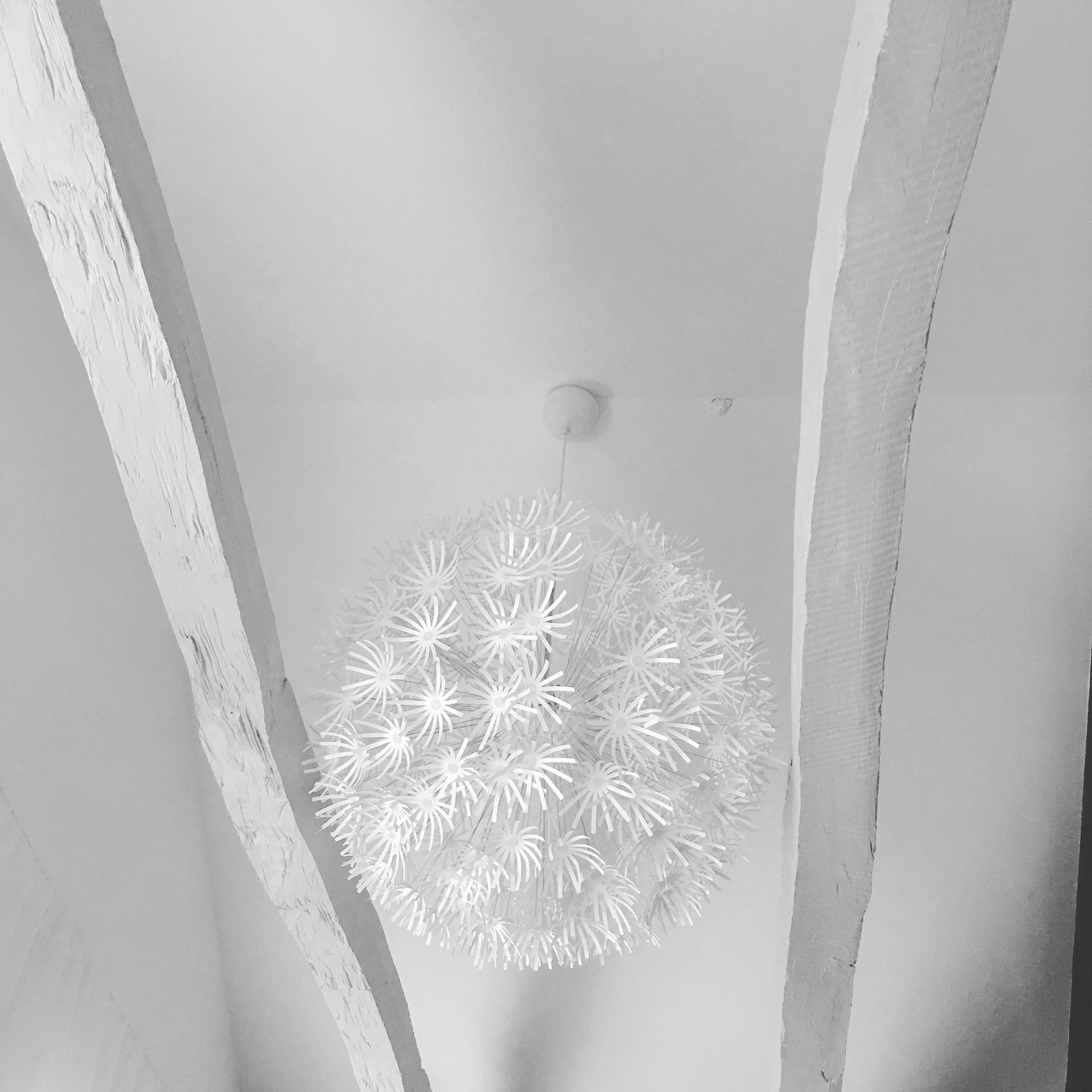 IKEA Maskros pendant lightshades work a treat in the high ceiling – and cast very pretty shadows...