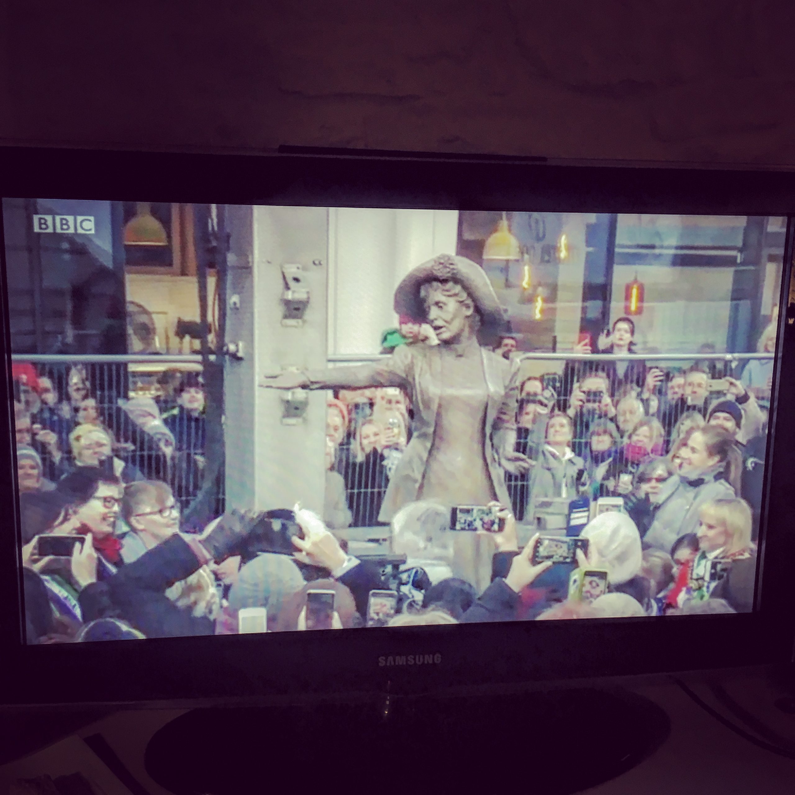 At last! Actually watching the unveiling of the Emmeline Pankhurst statue outside Manchester Central Library, on BBC NorthWest, in northern Istria!